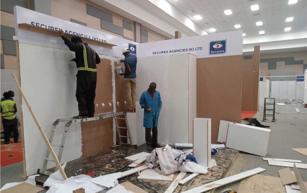 Expo booth installation in Nairobi Kenya showing custom exhibition stand fabrication and wall panel setup inside a mall.