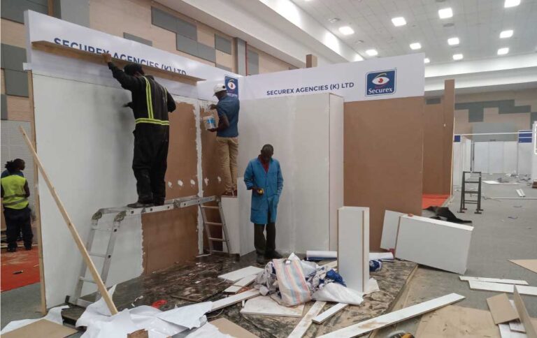 Expo booth installation in Nairobi Kenya showing custom exhibition stand fabrication and wall panel setup inside a mall.