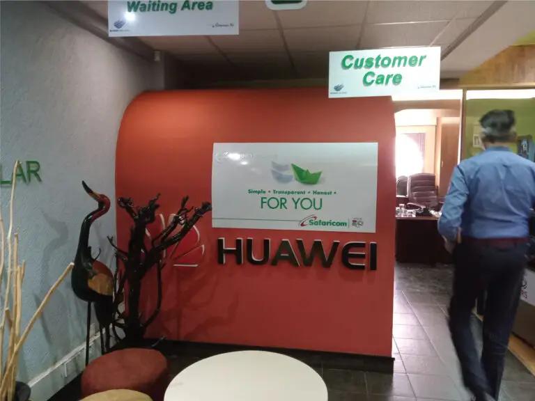 Branded reception partition installed by office partition contractors in Nairobi Kenya featuring a Huawei customer care area.