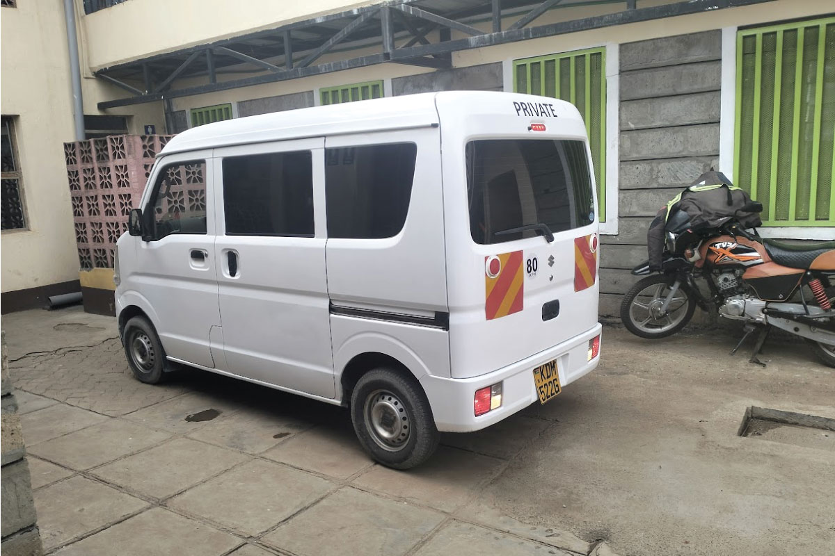 Unbranded small delivery van parked in Nairobi before vehicle branding in Kenya