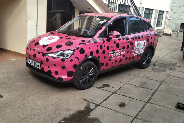 Branded company car Nairobi Kenya saloon front view.