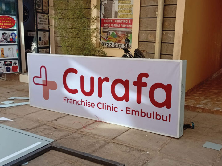 Lightbox sign makers in Nairobi Kenya fabricating custom LED backlit signage at Assure Solutions Ltd workshop