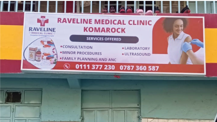 Installation of a framed banner sign at a client site in Nairobi, Kenya.