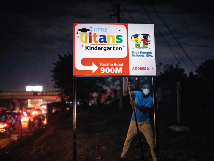 School directional sign board in Nairobi Kenya with clear arrows and easy to read wayfinding text