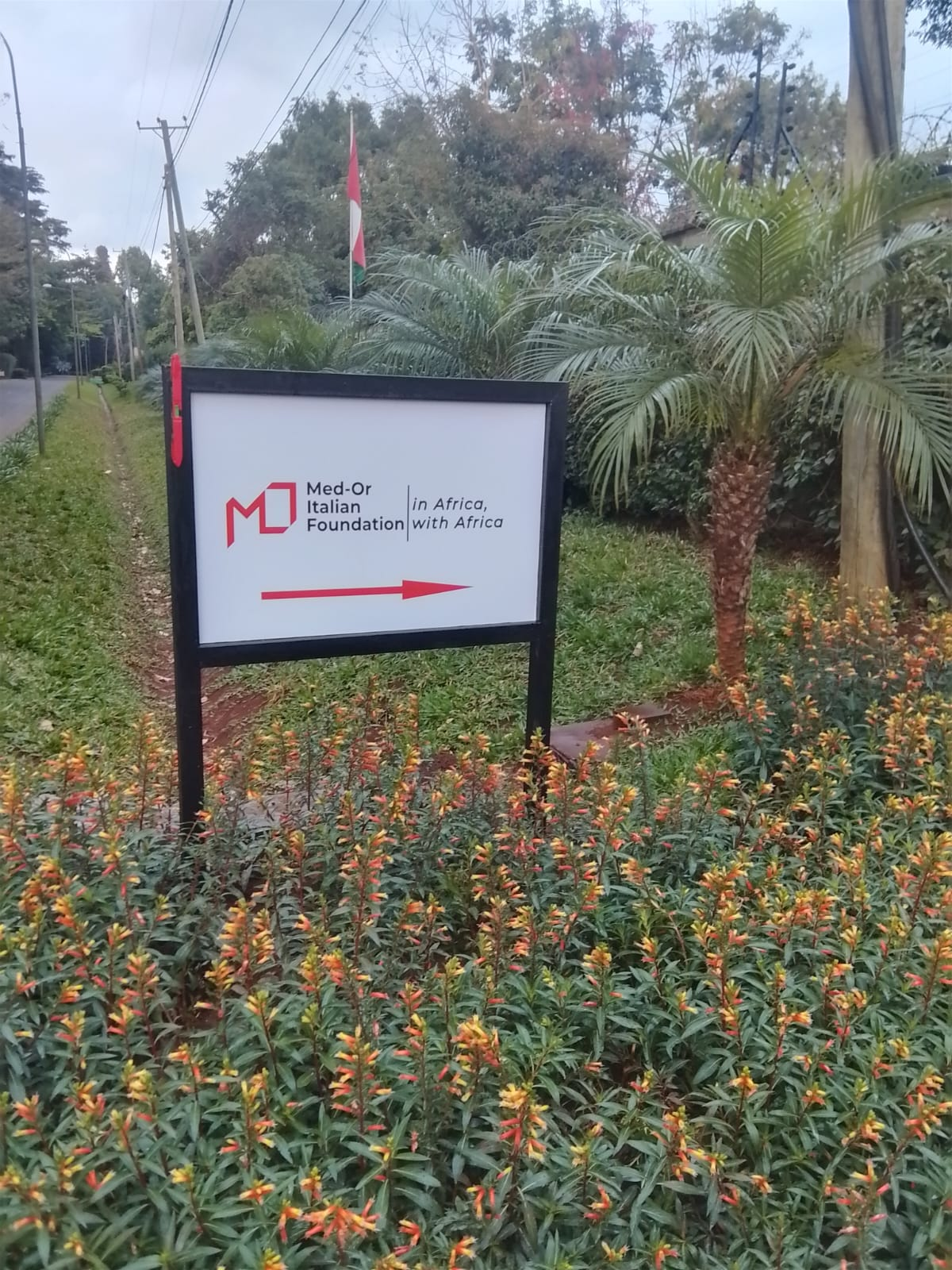 Med-Or directional road sign with red arrow in Nairobi Kenya