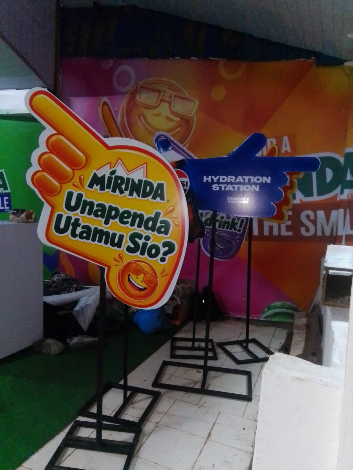 Mirinda and Pepsi promotional cut-outs on freestanding black bases