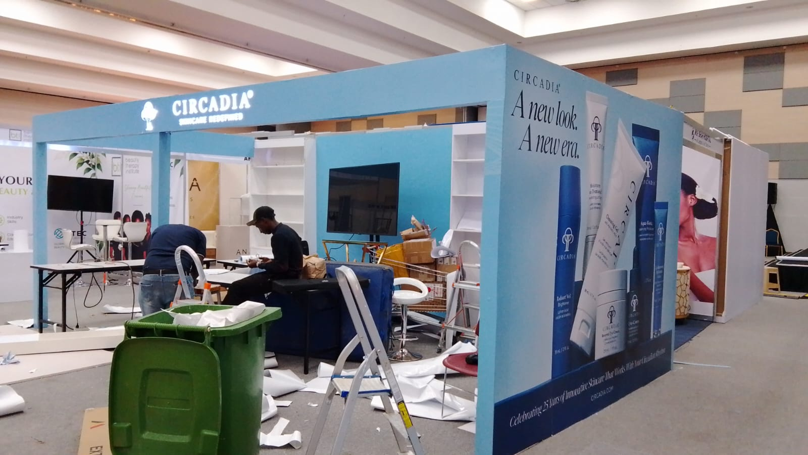 Circadia exhibition stand with a branded side wall during installation